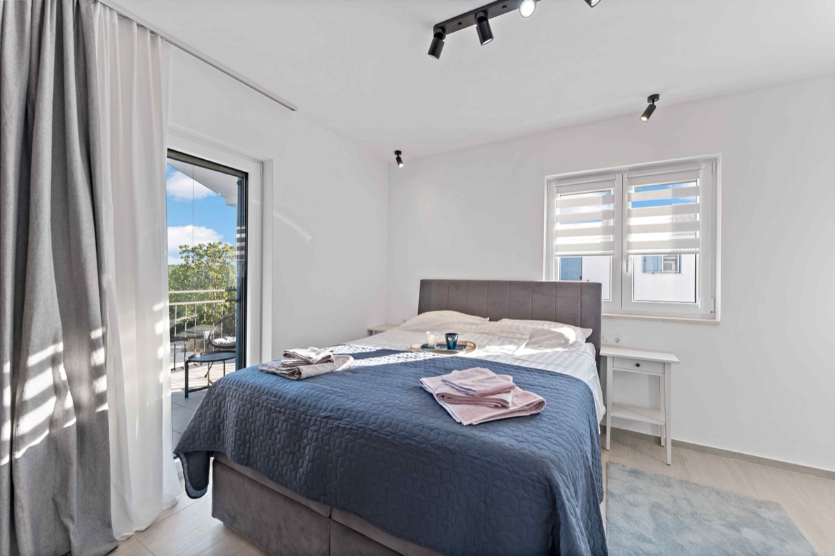 Bedroom with balcony access